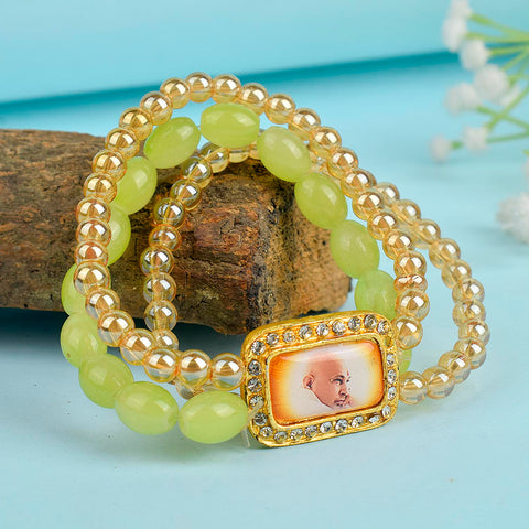 Golden Clear & Green Triple Layer Guruji Swaroop Bracelet featuring sparkling golden clear beads with vibrant green middle layer and Jai Guruji Swaroop – perfect for spiritual wear, meditation, and gifting. India’s Largest Pooja Accessories Brand – www.satvikstore.in