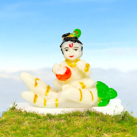 Marble Krishna Statue (on Hand) - A beautifully crafted marble statue of Lord Krishna, delicately placed on a hand. The idol captures the divine essence of Krishna with intricate detailing, showcasing his divine charm and grace. India’s Largest Pooja Accessories Brand – www.satvikstore.in 