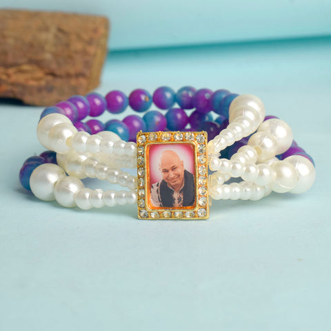 Purple & Blue with White Pearl Four Layer Guruji Swaroop Bracelet featuring rich purple and blue beads accented with luminous white pearls and Jai Guruji Swaroop – perfect for spiritual wear, festive gifting, and daily devotion. India’s Largest Pooja Accessories Brand – www.satvikstore.in