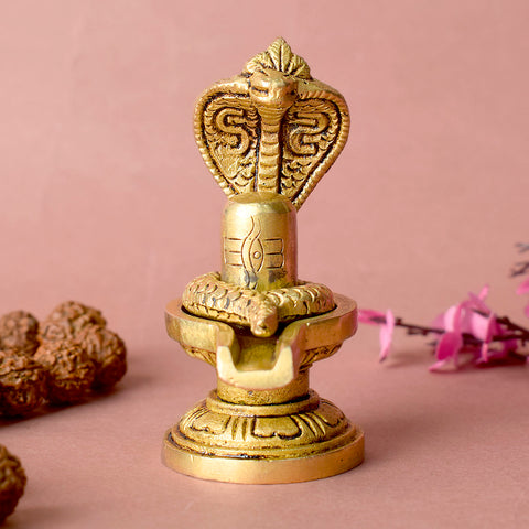 Elegant Brass Shivling with coiled Nag, symbolizing spiritual energy and protection, perfect for home worship and meditation. India’s Largest Pooja Accessories Brand – www.satvikstore.in